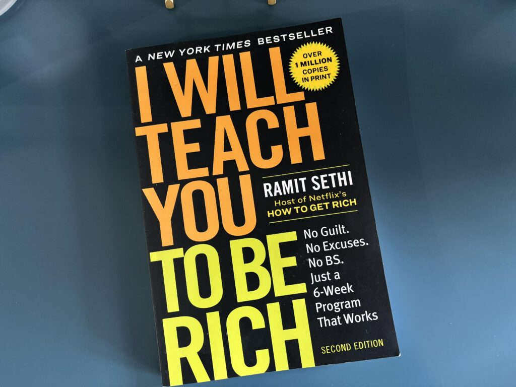 I Will Teach You To Be Rich book sitting on a counter